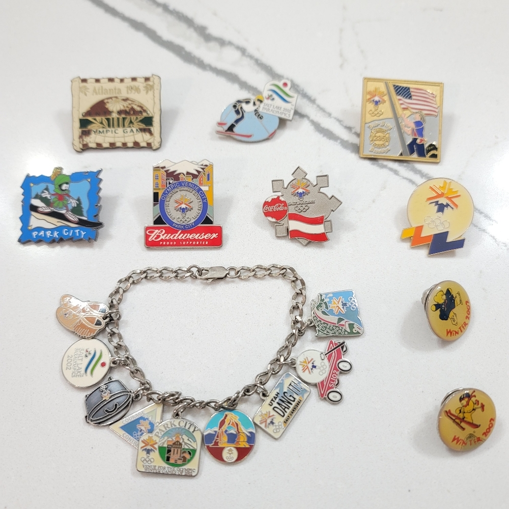Utah, Olympic, ski, budweiser, Disney pins and charms. Vintage collectable